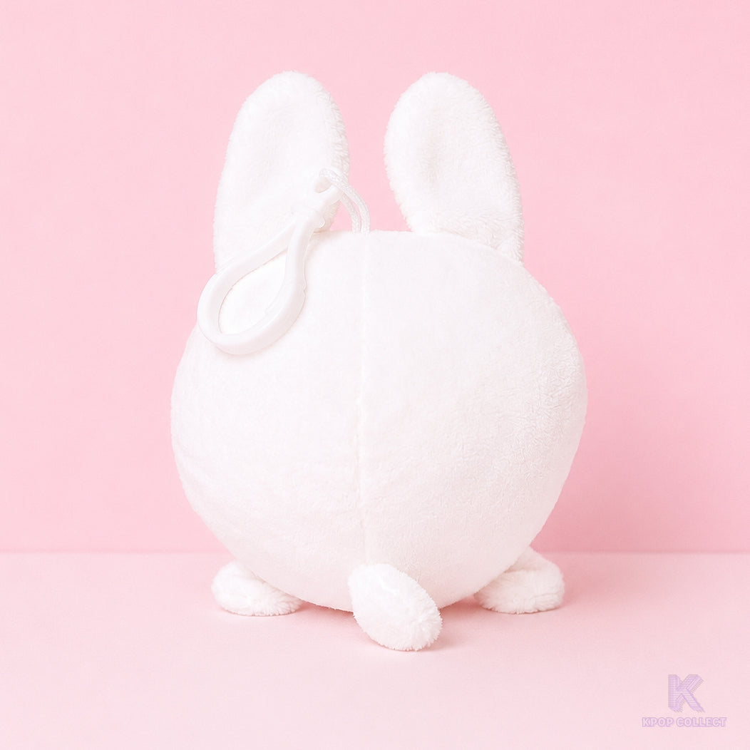 A back view of the soft, white Stray Kids Lee Know Leebit plush keychain, showcasing its round shape and cute bunny ears against a clean background.